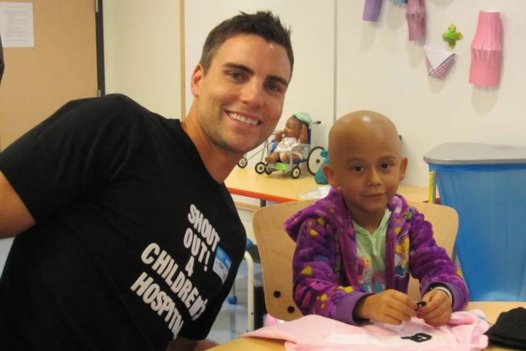 Colin at the Children's Hospital with a brave child 