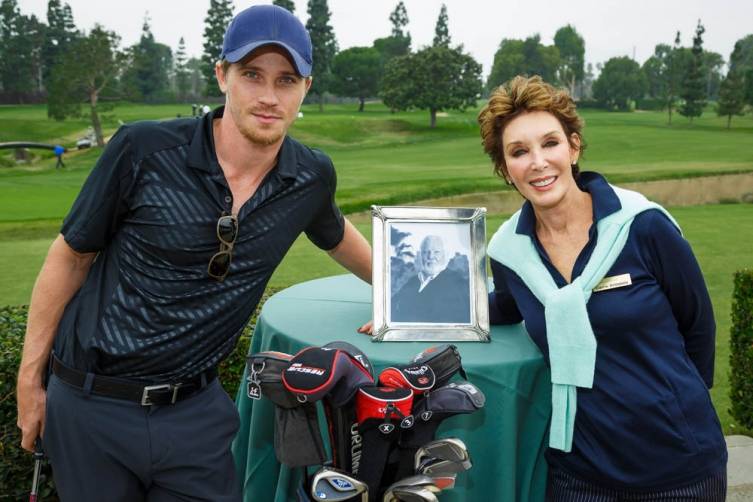 Garrett Hedlund and Carrie Brillstein get ready for the Bernie Brillstein Golf Tournament  