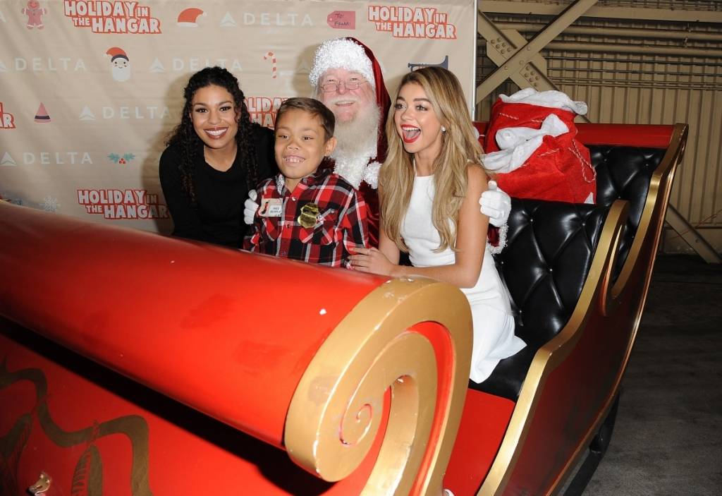 Jordin Sparks and Sarah Hyland at Delta Air Line's Fourth Annual Holiday in the Hangar 