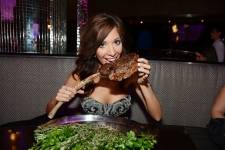 Farrah Abraham poses with Tomahawk Steak at N9NE Steakhouse. Photos: Denise Truscello/WireImage